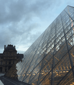 part of the facade of the glass pyramid at the Louvre